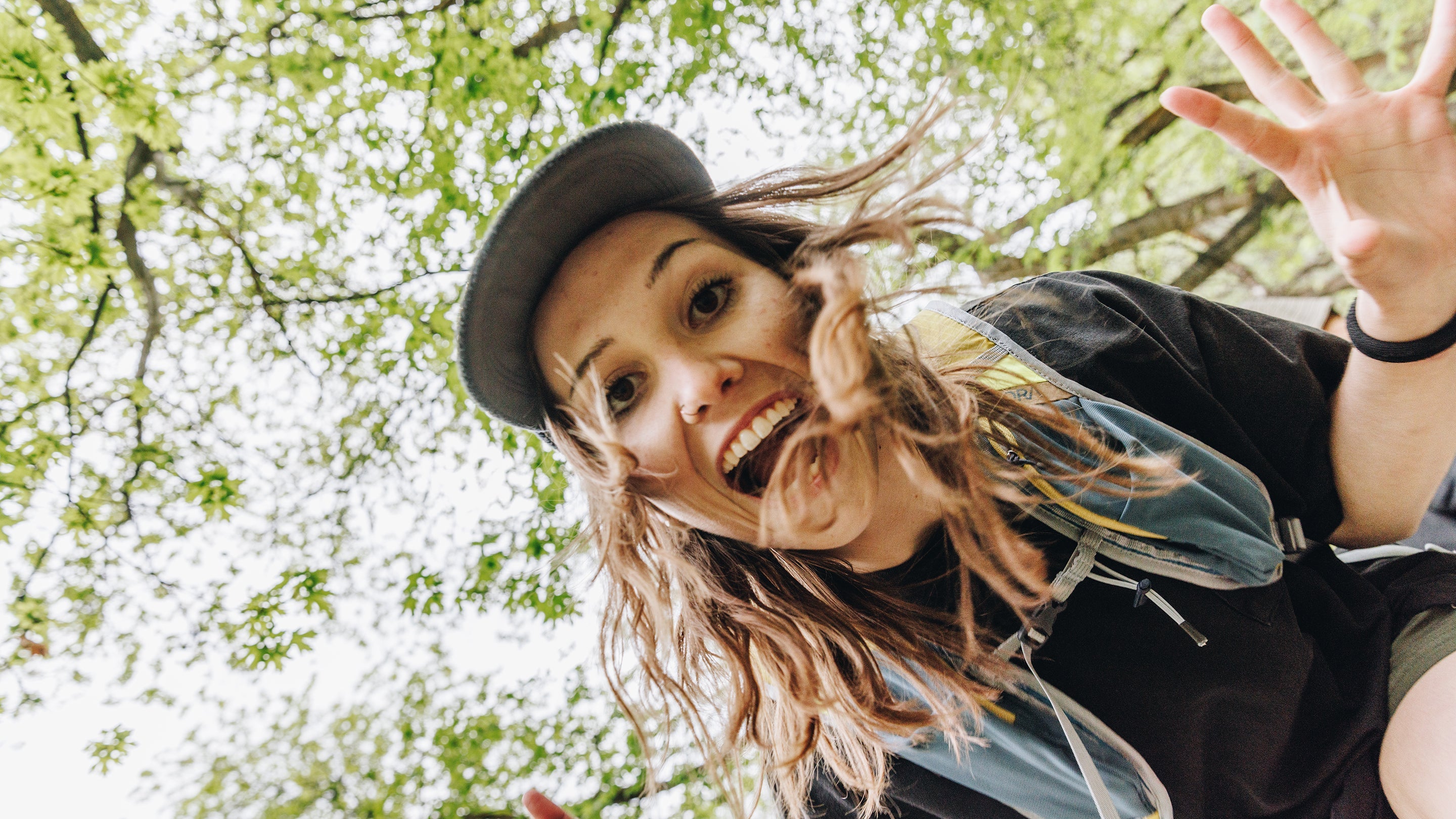 young woman looking into camera with excitement