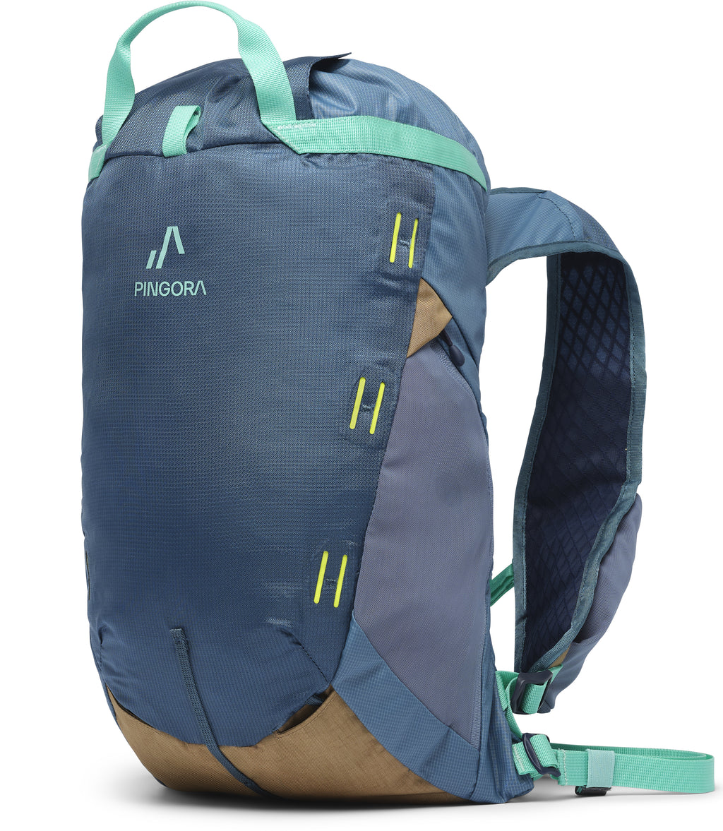 An ocean color Pingora 15 liter climbing and hiking backpack that features multiple zippers and side straps.