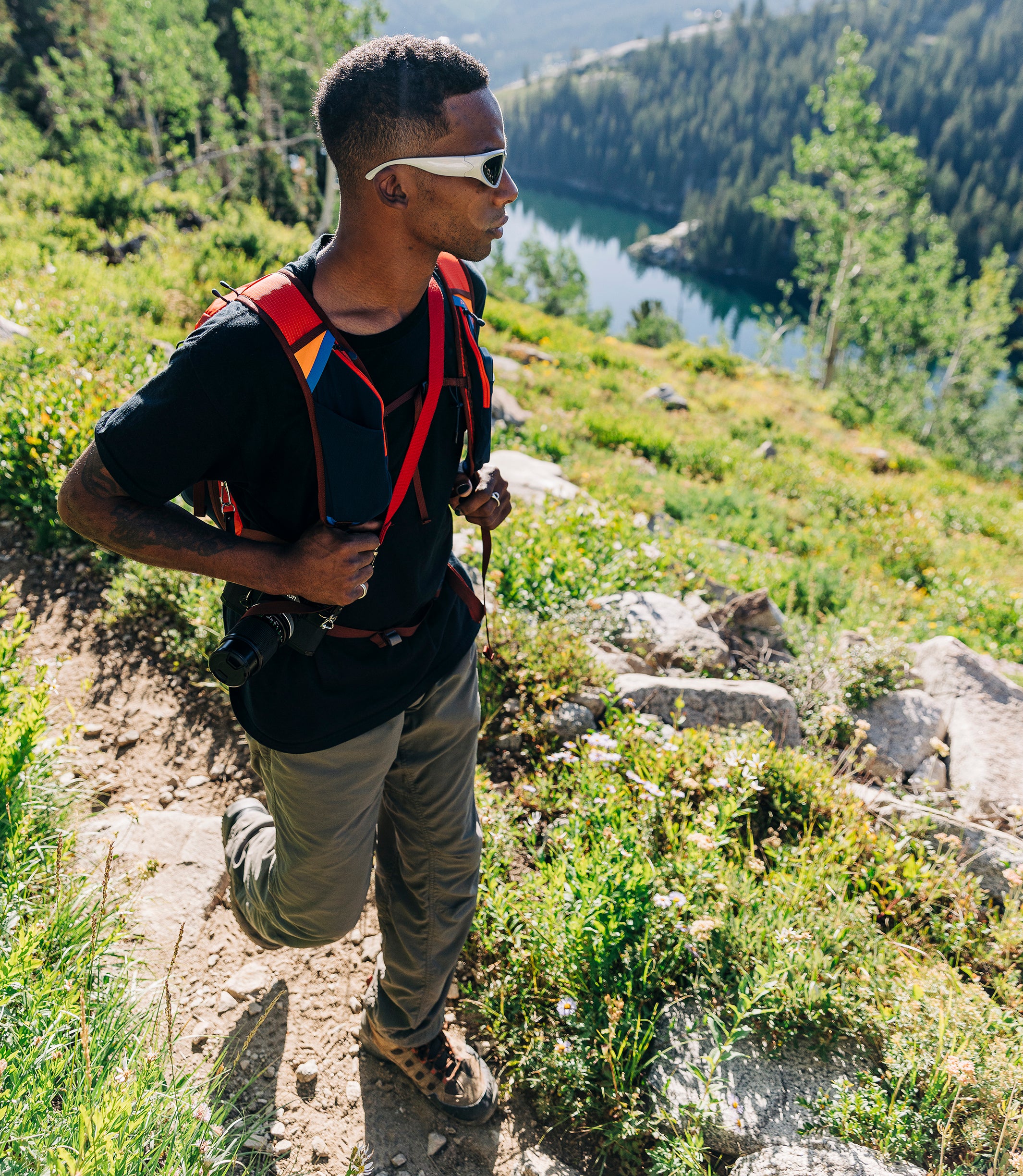 A hiker using the Pingora Focus 23 liter climbing and hiking backpack on the trail