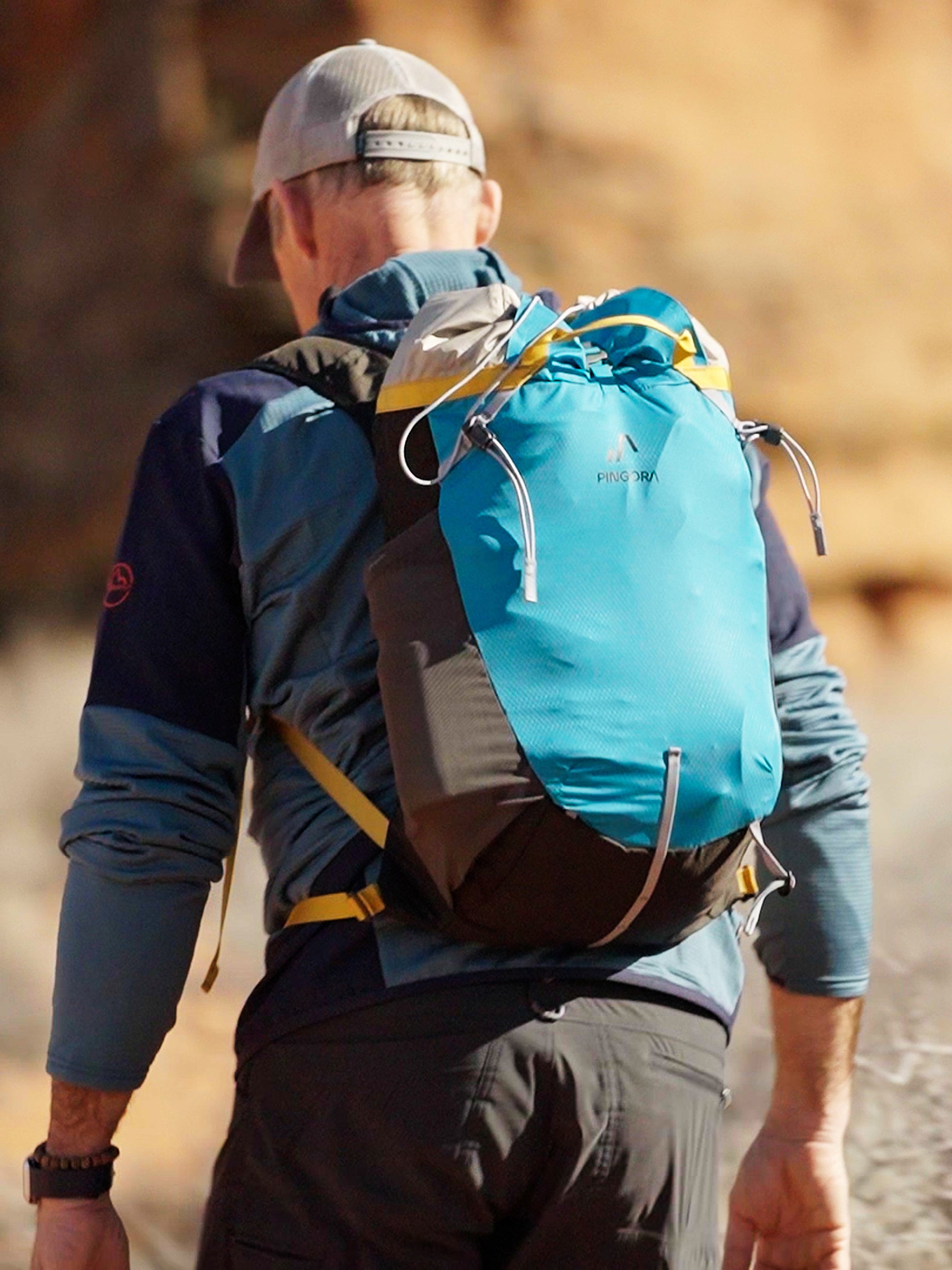A live hiker wearing the Pingora Focus 25 liter climbing and hiking backpack.