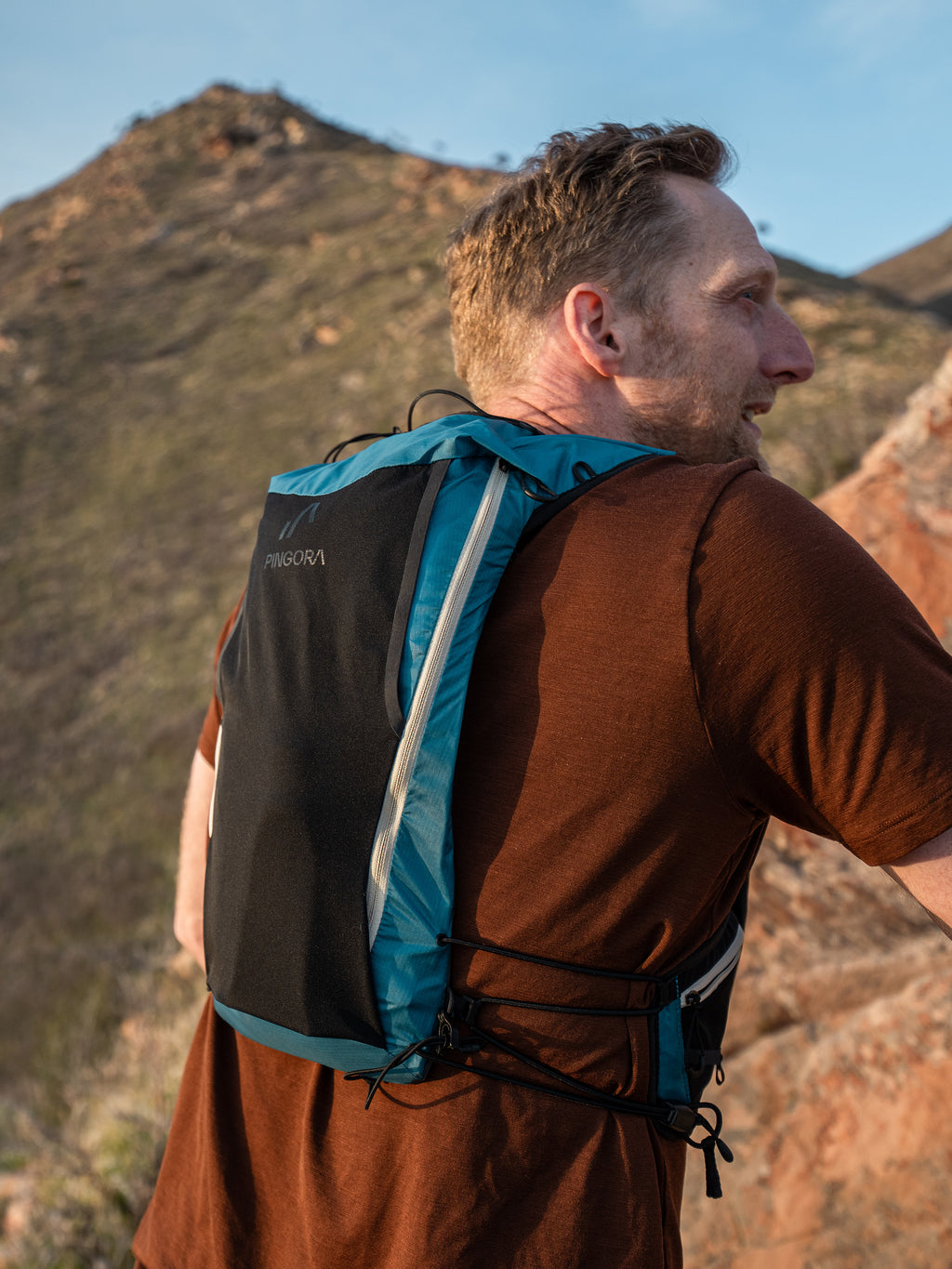 Pingora Flow trail running backpack in blue color on model