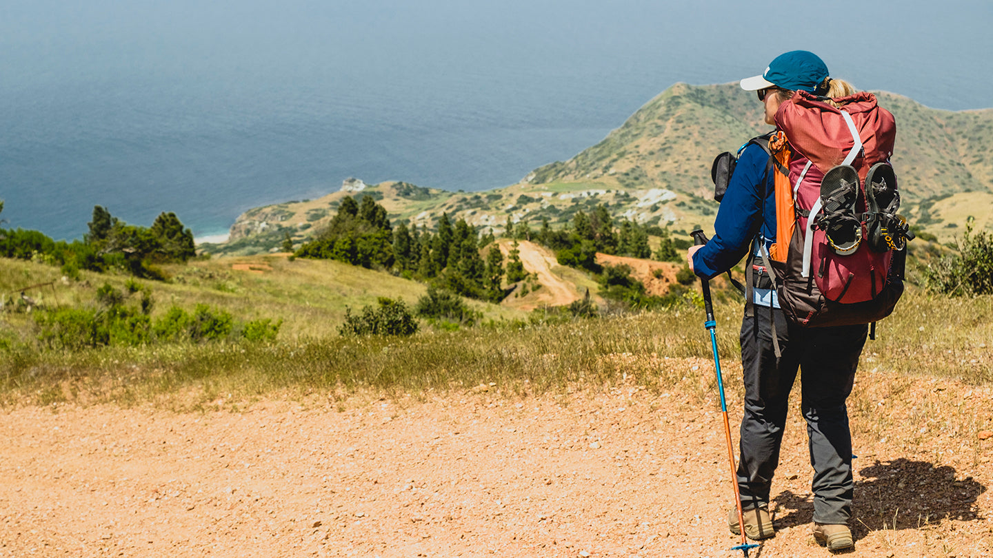 HIker on a backpacking trip with the Pingora Outro pack