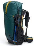 A green and black Outro 40 backpack with yellow straps and side pockets, designed for backpacking, shown with a medium hip belt and additional pockets.