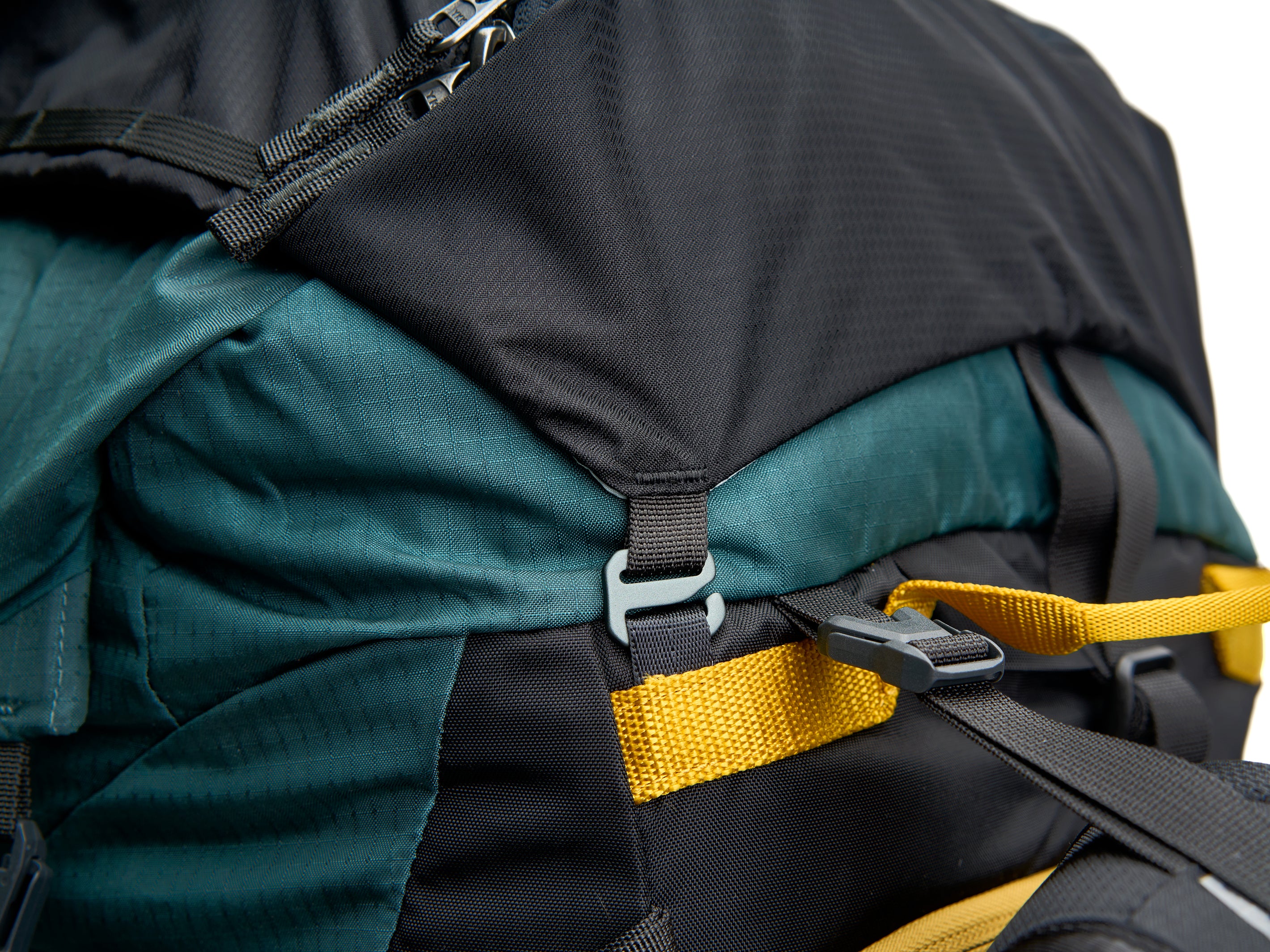 The Pingora Top Pocket for additional backpack storage, branded Pingora, with a zipper closure and a clip attachment. Showing the top pocket attached to an Outro backpack